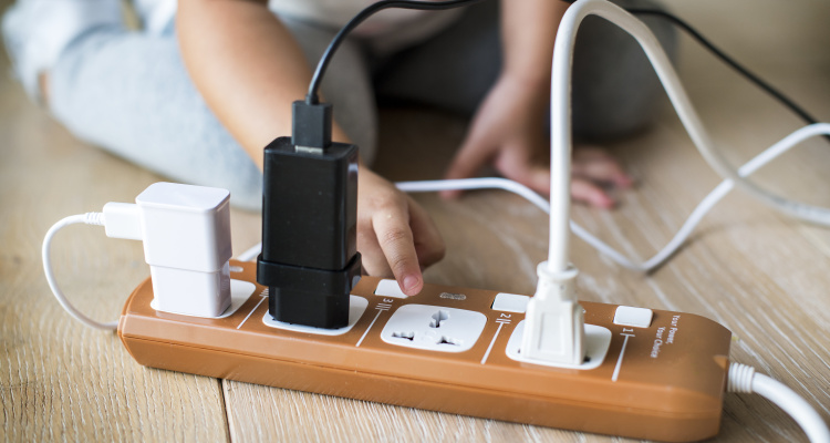 Toddler playing with plug